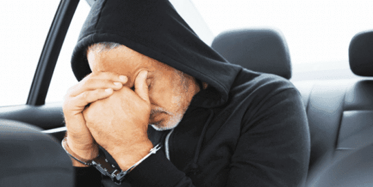 Man arrested in back of police car to symbolize a FL hardship license