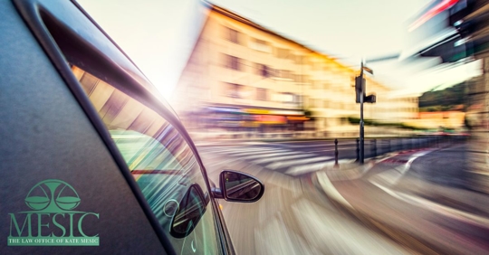 car traveling at high speeds turning a corner