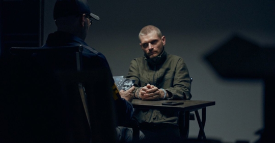 Cop interrogating a person