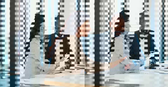 Businesspeople reading a contract