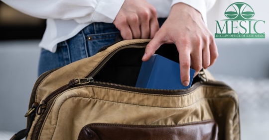 a person stealing an item