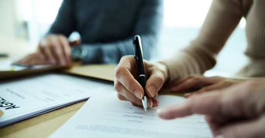 Entrepreneur signing a contract agreement
