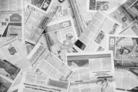 Image containing scattered newspapers